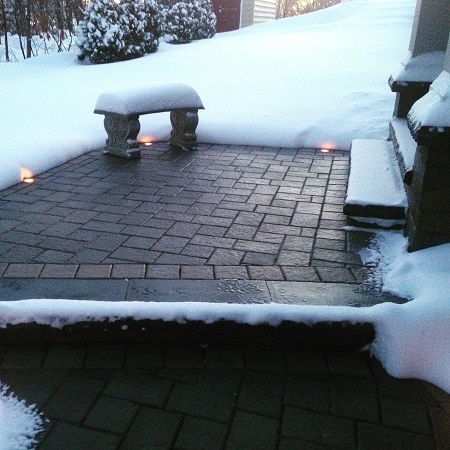 Heated mat, potentially solar powered, to melt the snow off of